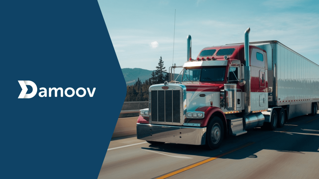 A red truck driving on a highway, symbolizing fleet safety and efficiency powered by Damoov’s mobile telematics technology.