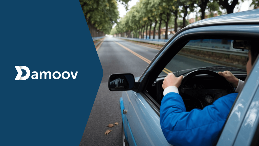 Driver on a tree-lined road representing PAYD and PHYD insurance models enabled by Damoov's mobile telematics.