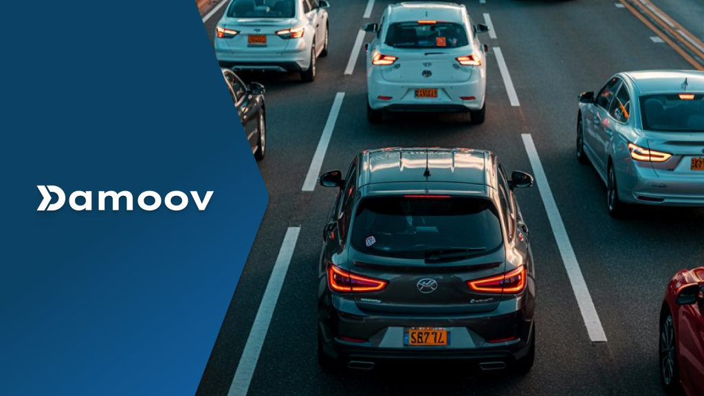 Multiple cars driving on a multi-lane highway during sunset traffic, symbolizing the role of mobile telematics in monitoring driving behavior and potentially replacing dashcams.