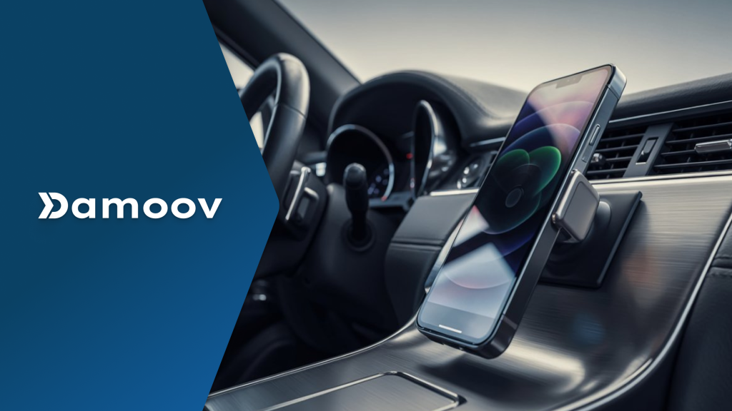 A smartphone mounted on a car dashboard next to the steering wheel, representing mobile telematics as a virtual driving assistant.