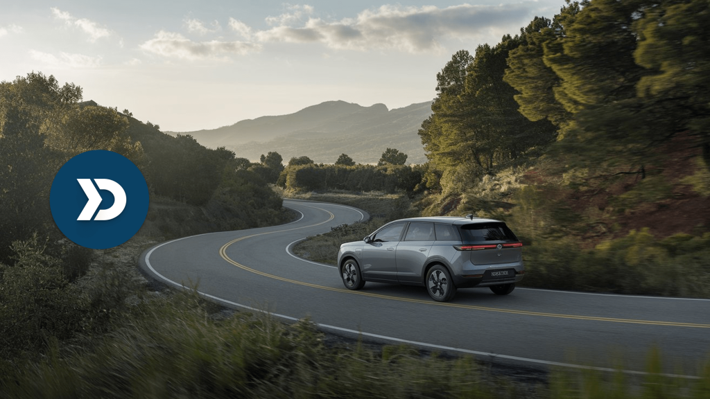 Electric SUV driving through a scenic mountain road, illustrating eco-driving with mobile telematics technology.