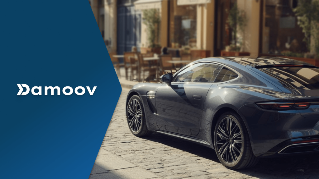 Luxury coupe parked on a European cobblestone street near an outdoor café — representing data transparency in smartphone-based insurance apps powered by mobile telematics.